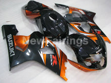 Laden Sie das Bild in den Galerie-Viewer, Black and Orange Factory Style - GSX-R600 04-05 Fairing Kit